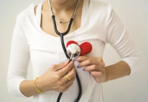 person with a stethoscope and a heart