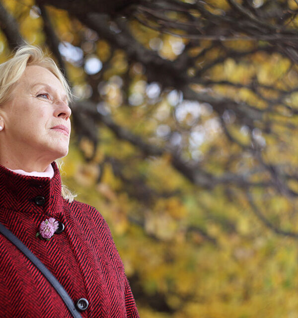 woman in menopause walking in park