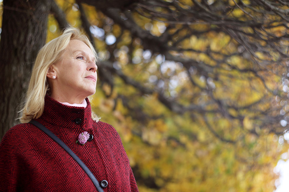 woman in menopause walking in park