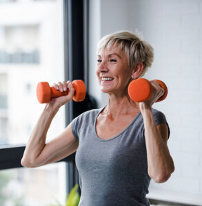 menopausal woman lifting weights