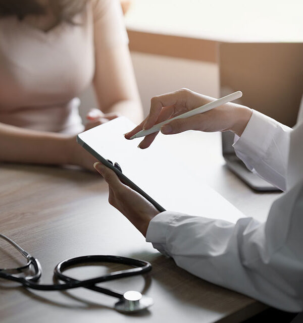 Doctor going over test results with patient