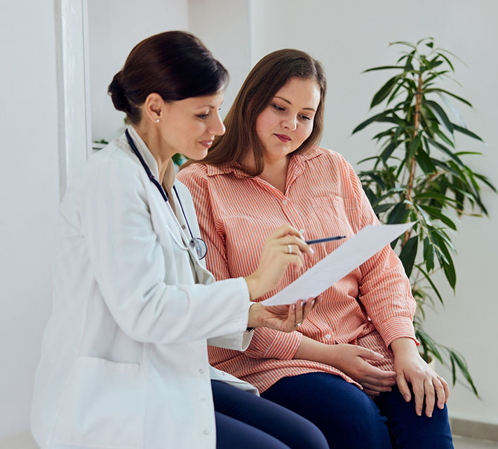 patient with doctor going over testing