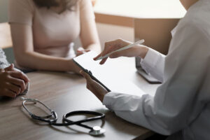 Doctor going over test results with patient