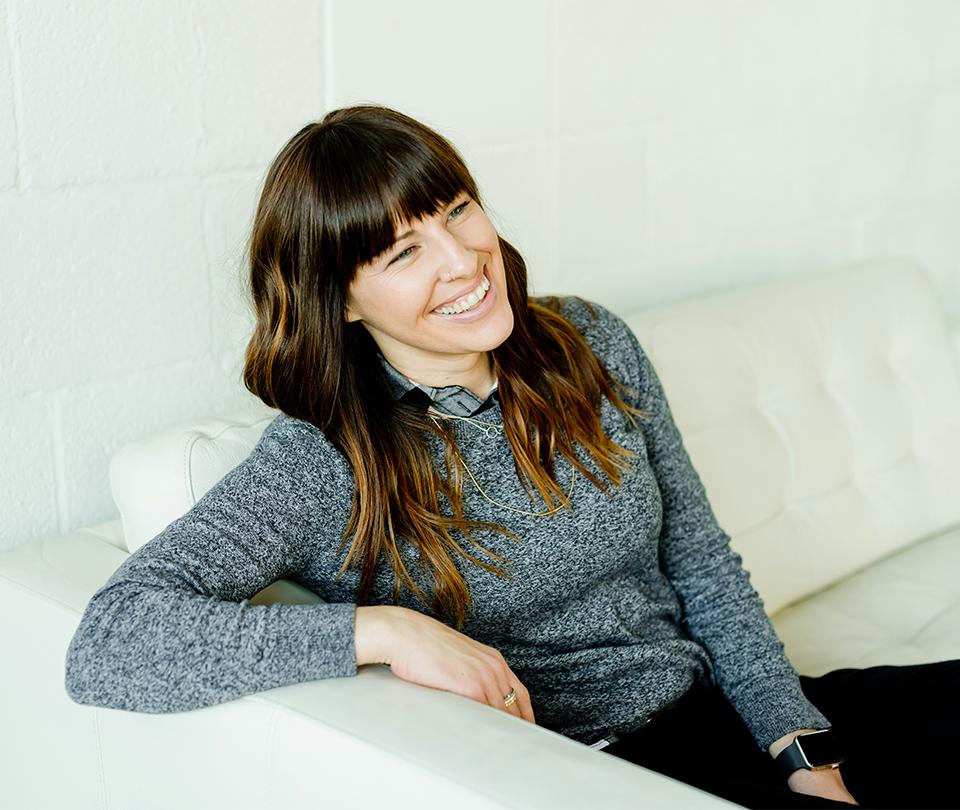Confident woman sitting on couch